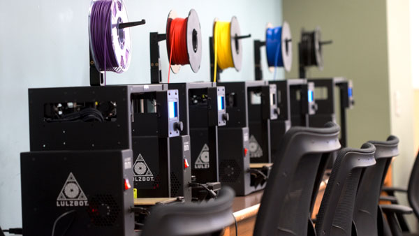 A row of Lulzbot Mini2 3D printers is pictured in the new Makerspace in King Library